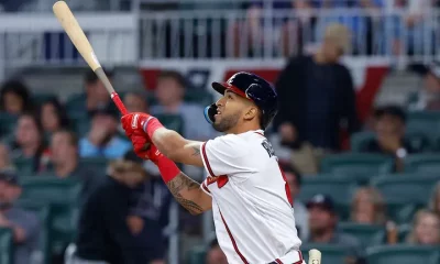 Eddie Rosario of the Atlanta Braves hits a solo home run during the eighth inning against the Cincinnati Reds on April 12, 2023 in Atlanta, Georgia