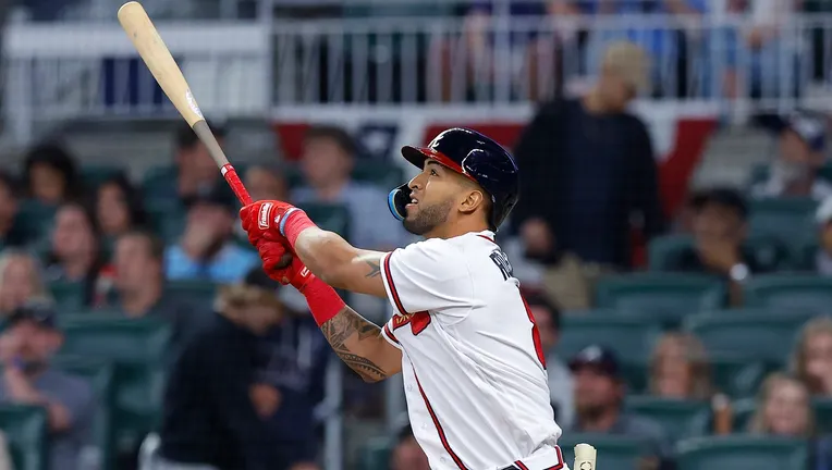 Eddie Rosario of the Atlanta Braves hits a solo home run during the eighth inning against the Cincinnati Reds on April 12, 2023 in Atlanta, Georgia